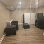 Completed basement remodel with wood-look flooring in Lehigh Valley, PA